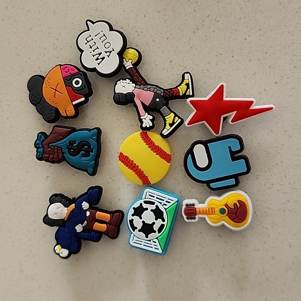 3/$25 croc charms- 10 assorted